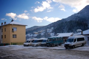 Mini-buses wait for departure at Smolyan bus station. 